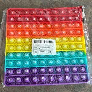 Rainbow colored Popper that is numbered 1-100